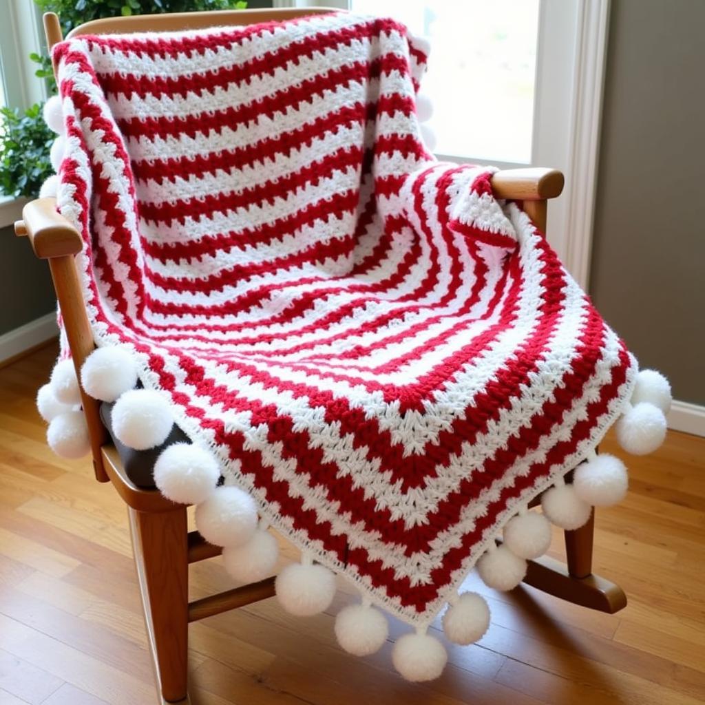 Christmas crochet blanket with pom-pom