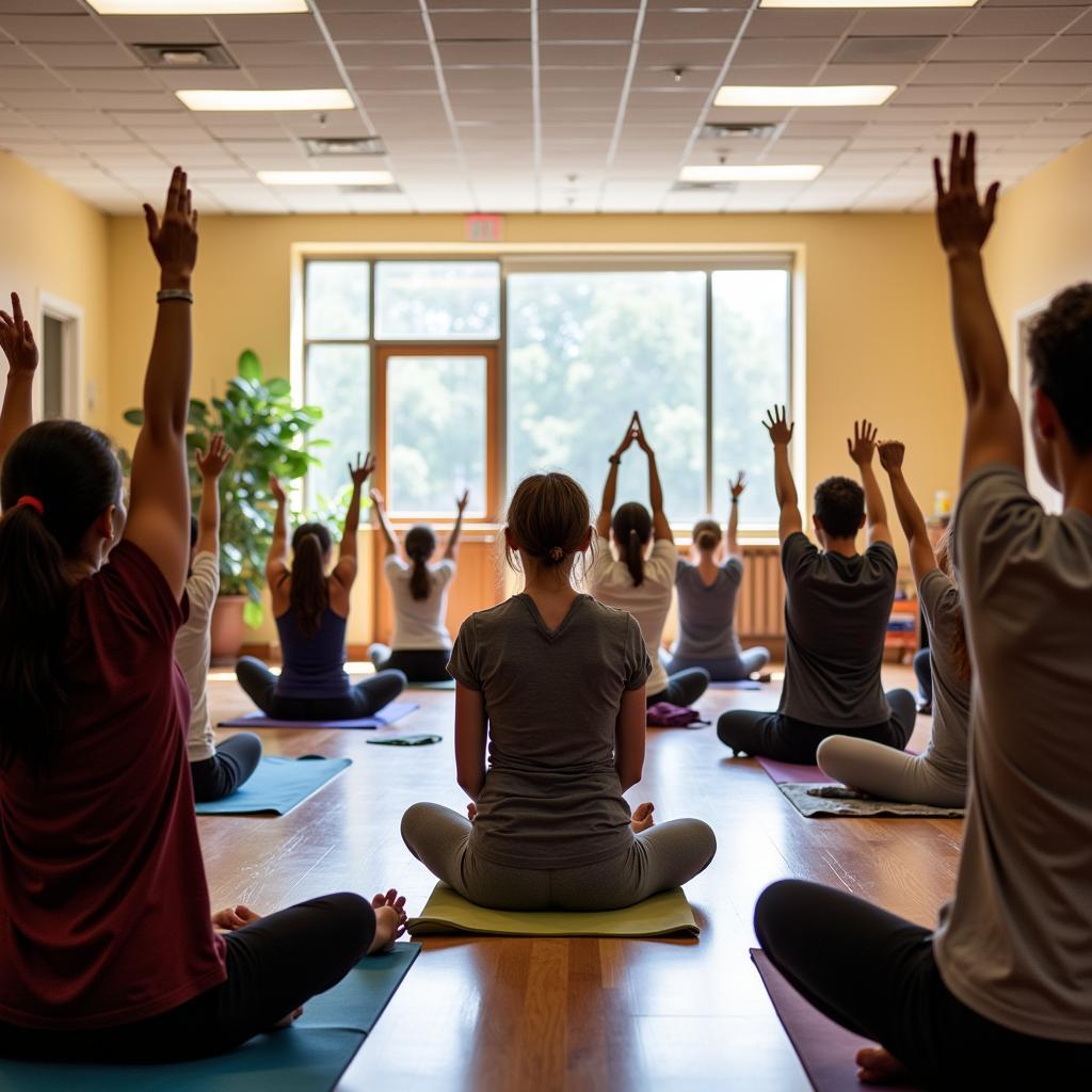 A diverse group of people practicing yoga inside a community center in Nashville