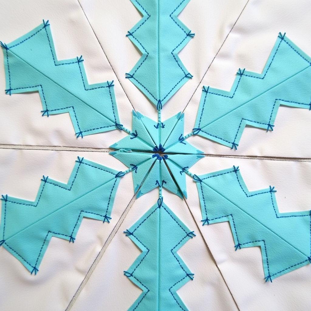 Close-up of a paper pieced snowflake quilt block