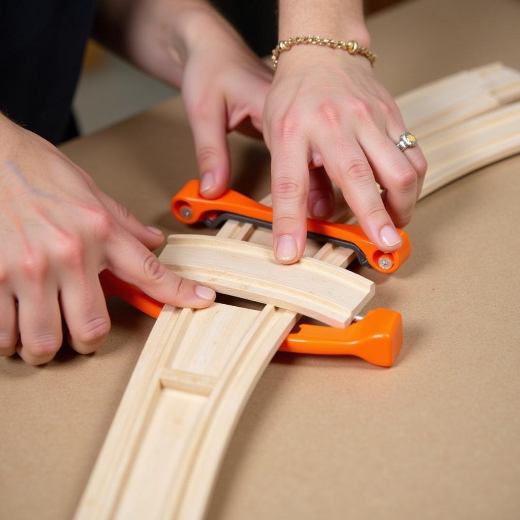 Assembling Wooden Train Track Pieces