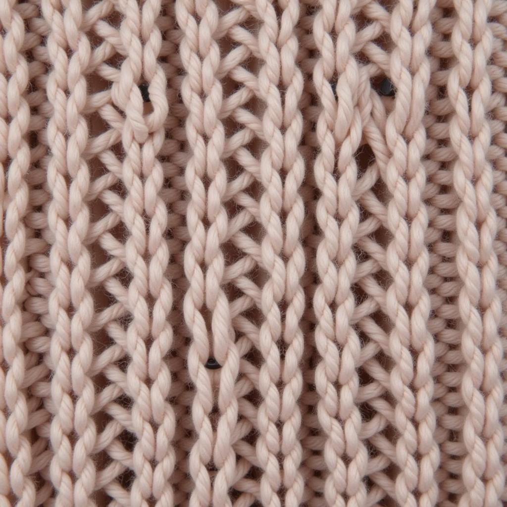 Close-up of the fisherman's rib knit stitch showing its textured and plush appearance.