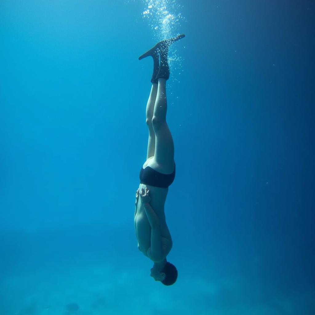 Freediver in Streamlined Descent