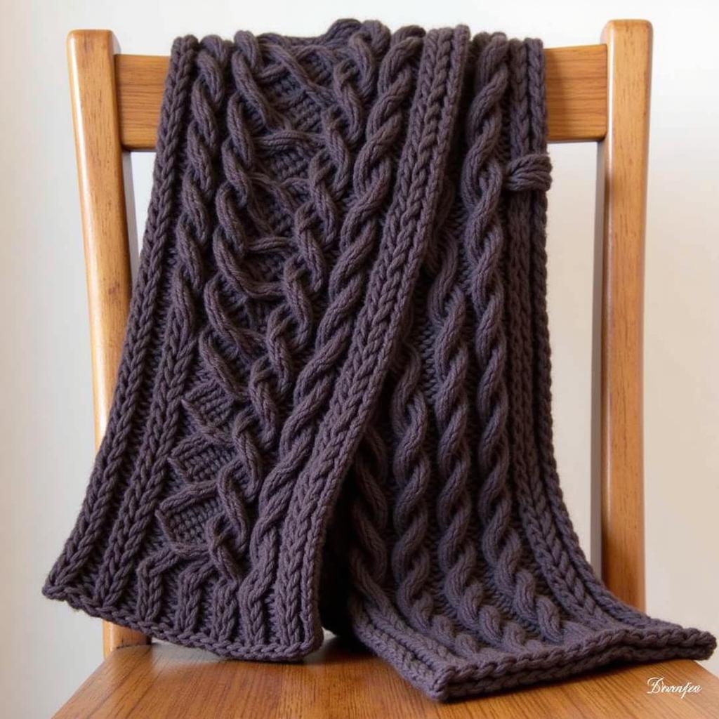 Intricate cable knit scarf pattern for experienced knitters